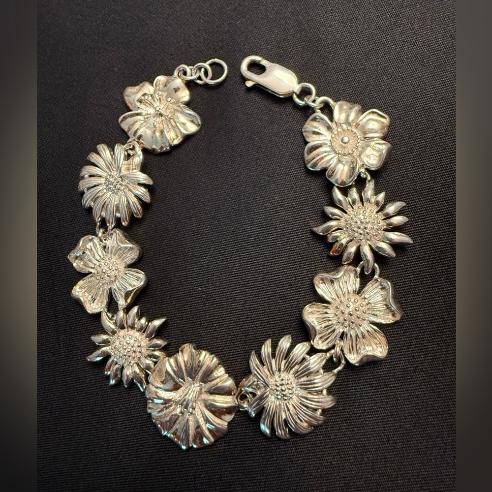 Exceptional bracelet: Sterling Silver sunflowers,dogwood & curly petals.Unusual.